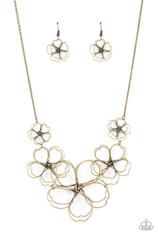 Paparazzi Accessories The Show Must GROW On - Brass Rustic brass wire delicately twists into oversized blossoms. Gradually increasing in size, the 3D frames elegantly pop beneath the collar. Features an adjustable clasp closure. Sold as one individual nec