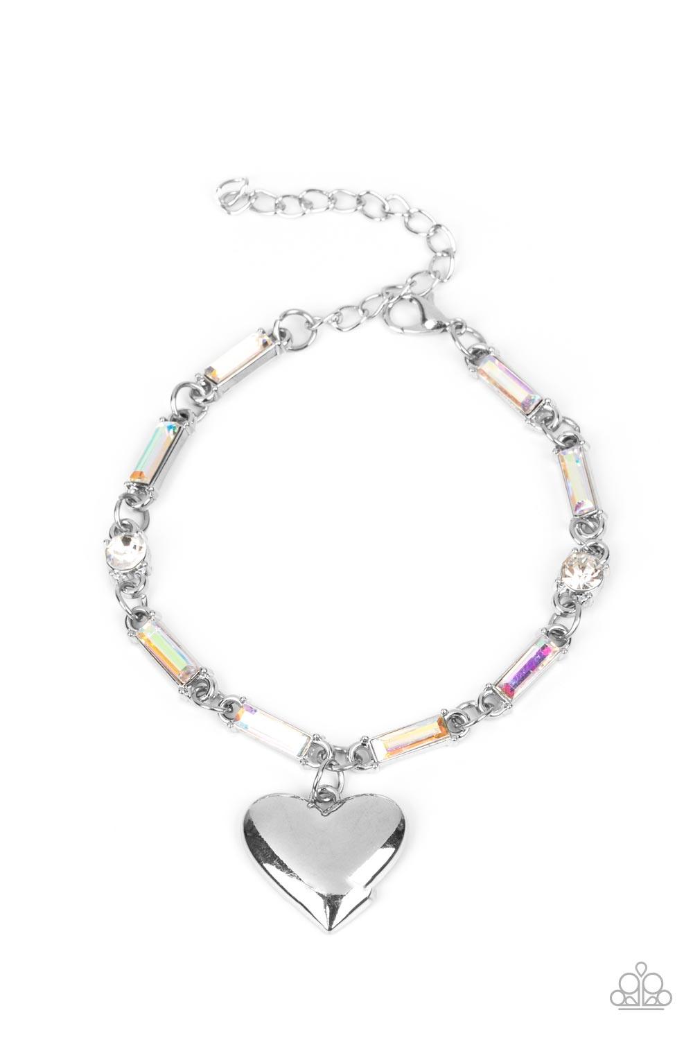 Paparazzi Accessories Sweetheart Secrets - Multi Encased in sleek silver fittings, classic white rhinestones and emerald cut iridescent rhinestones delicately link into a sparkly chain around the wrist. A shiny silver heart charm swings from the glittery