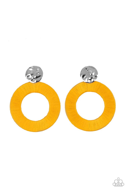 Paparazzi Accessories Strategically Sassy - Yellow A hammered silver disc gives way to an oversized metal hoop wrapped in golden yellow thread, resulting in a modern lure. Earring attaches to a standard post fitting. Sold as one pair of post earrings. Ear