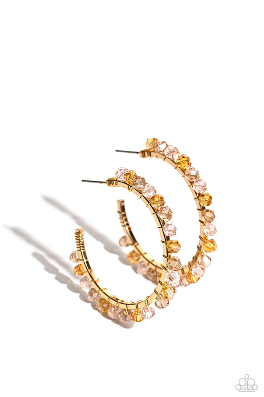 Paparazzi Accessories Halo Hustle - Pink Threaded along a dainty gold wire, an iridescent collection of pink, golden, and champagne colored crystal-like beads wrap around the front of a classic gold hoop for an unexpected pop of shimmer. Hoop measures app