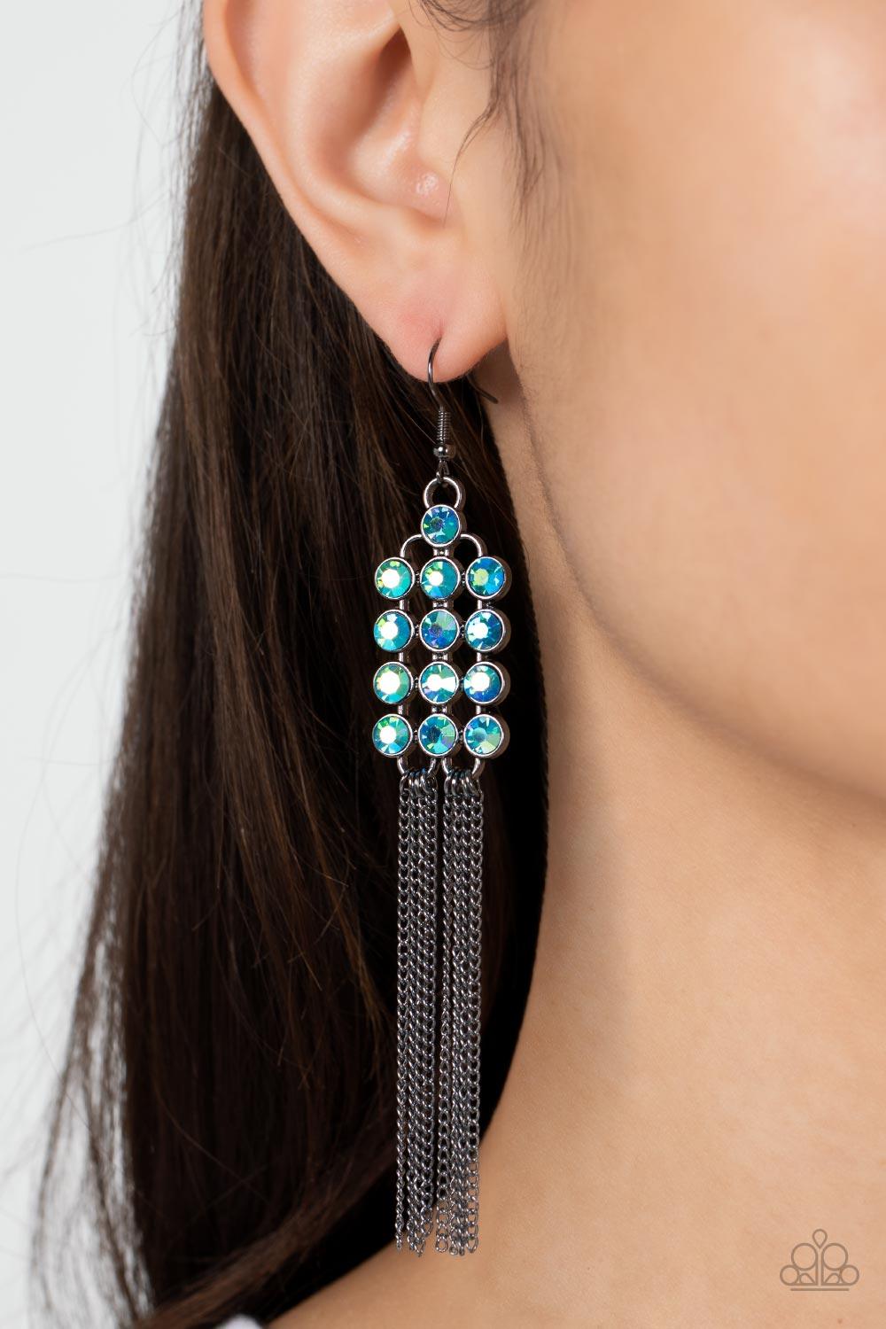 Paparazzi Accessories Tasteful Tassel - Multi Encased in sleek hematite fittings, rows of glittery multi-colored oil spill rhinestones stack into a sparkly frame. Dainty gunmetal chains stream from the bottom of the dazzling frame, adding flirtatious move
