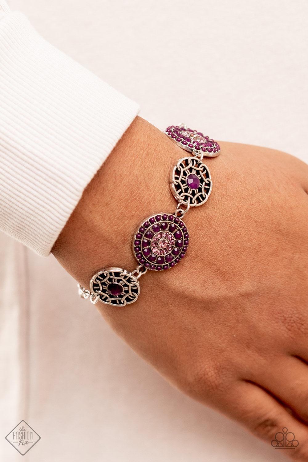 Paparazzi Accessories Vogue Garden-Variety - Purple Bursts of faceted plum beads and sparkling light amethyst rhinestones radiate from the centers of antiqued silver frames, while smaller airy frames are dotted with plum centers. The whimsical designs del