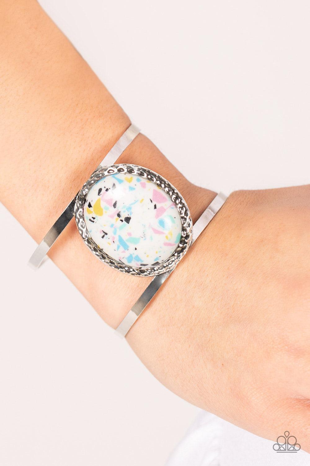 Paparazzi Accessories Tantalizingly Terrazzo - Multi Featuring a colorful terrazzo finish, an oversized multi-colored stone is pressed into the center of a hammered silver frame atop a layered silver cuff for a modern stone look. Sold as one individual br