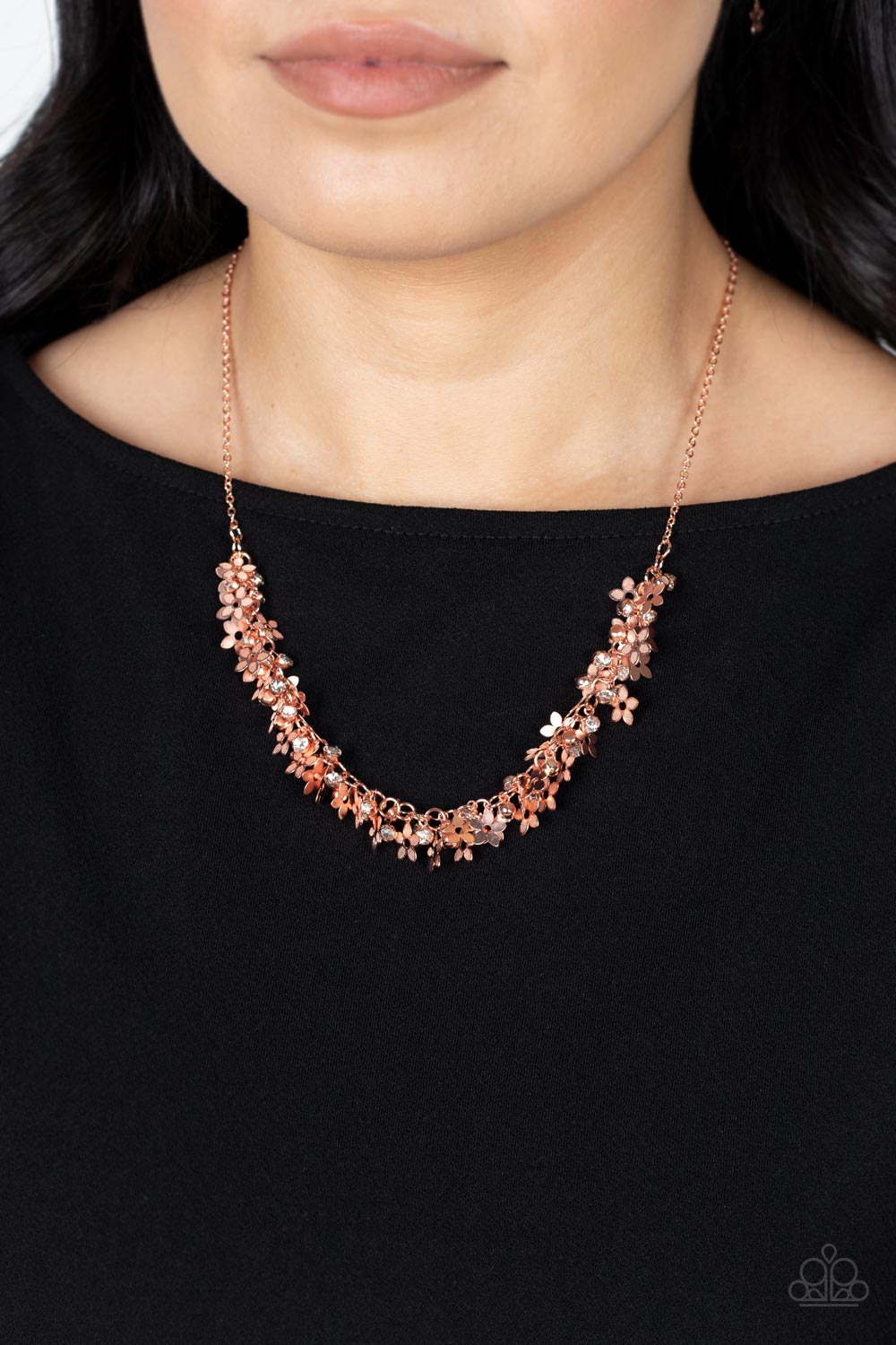 Paparazzi Accessories Fearlessly Floral - Copper Featuring textured petals, a dainty collection of shiny copper flower frames and glassy white rhinestones delicately cluster along the bottom of a shiny copper chain for a flirtatious floral look below the