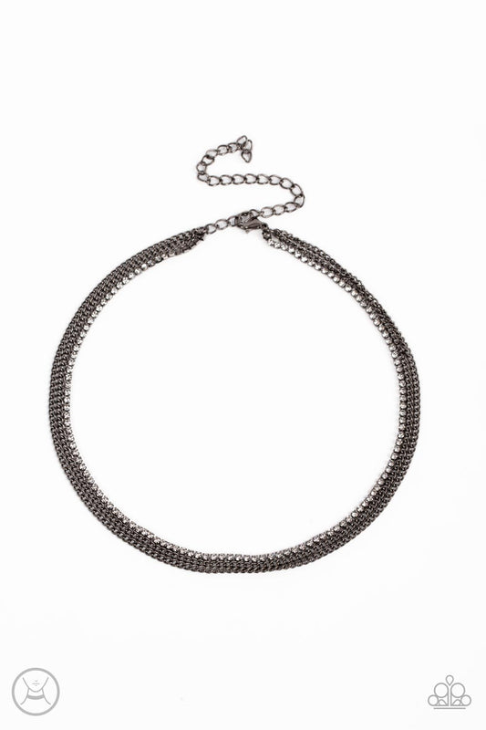 Paparazzi Accessories Glitzy Gusto - Black Two glistening gunmetal chains and a single strand of dainty white rhinestones effortlessly layer around the neck, resulting in a radiant look. Features an adjustable clasp closure. Sold as one individual choker