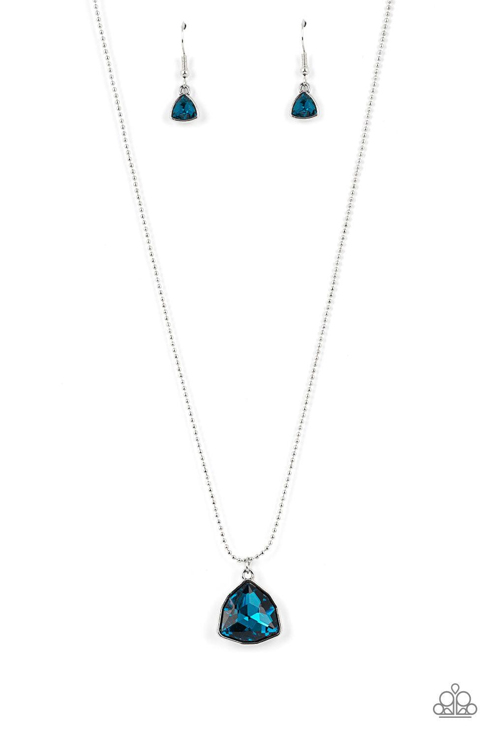 Paparazzi Accessories Galactic Duchess - Blue A faceted asymmetrical blue gem is encased in a sleek silver frame at the bottom of a silver popcorn chain, creating a stellar pendant below the collar. Features an adjustable clasp closure. Sold as one indivi