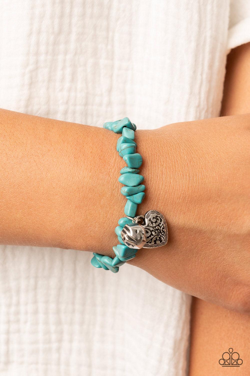 Paparazzi Accessories Love You to Pieces - Blue Infused with a hammered silver bead and a decorative silver heart charm, an earthy collection of turquoise pebbles are threaded along a stretchy band around the wrist for a whimsical fashion. Sold as one ind
