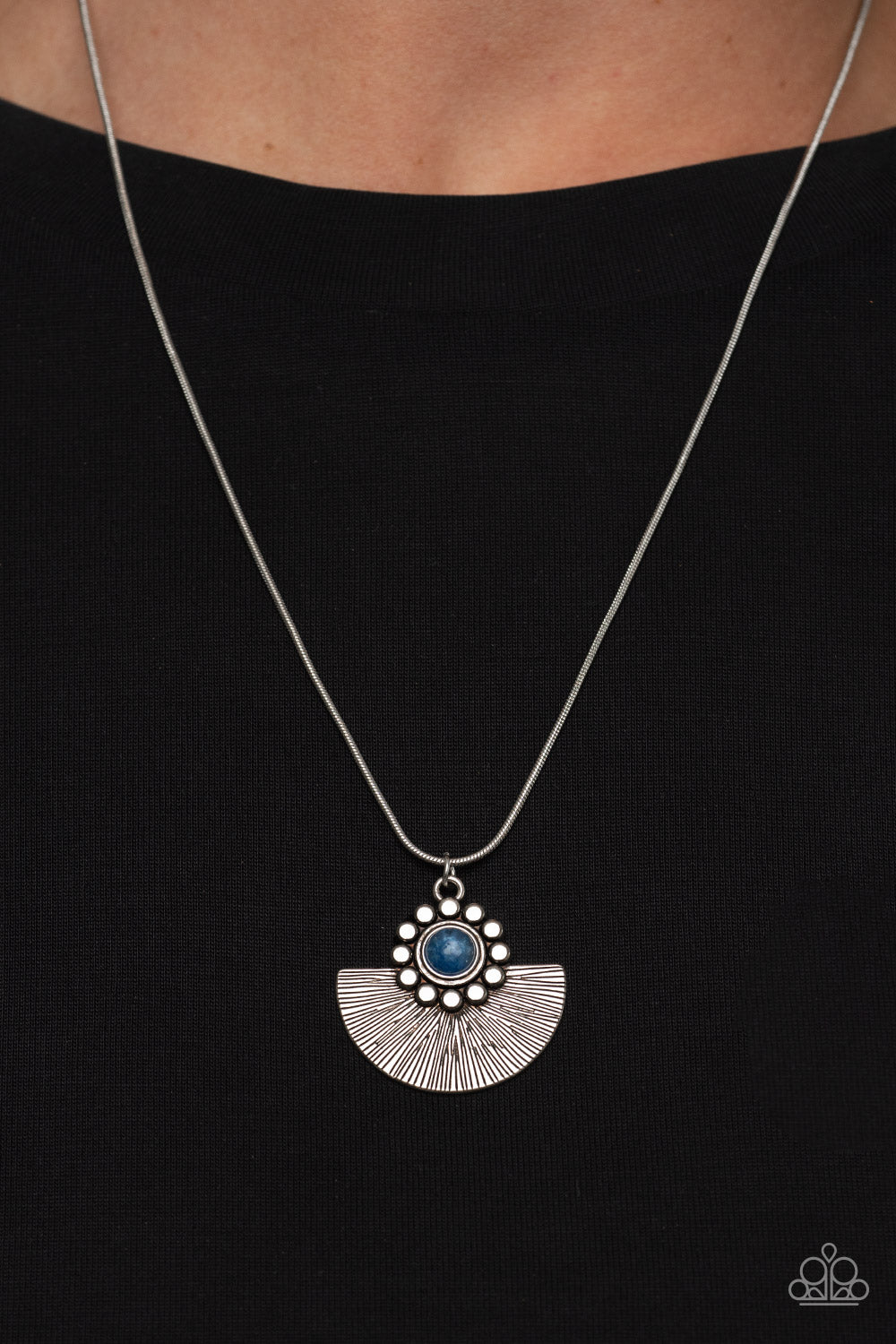 Paparazzi Accessories Magnificent Manifestation - Blue Bordered in a ring of flat silver studs, a mystical blue bead adorns the top of a textured silver half moon pendant that glides along a rounded silver snake chain for an ethereal fashion. Features an