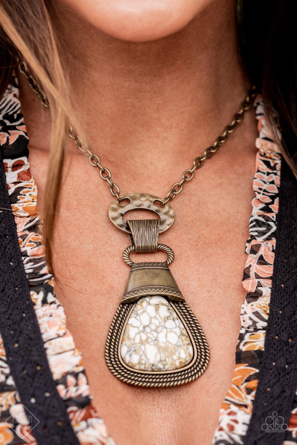 Paparazzi Accessories Rodeo Royale - Brass An earthy brown and white marbled stone is encased in a brass frame made up of layers of rope-like texture and topped with an antiqued brass adornment stamped in rustic patterns. The robust pendant swings from a