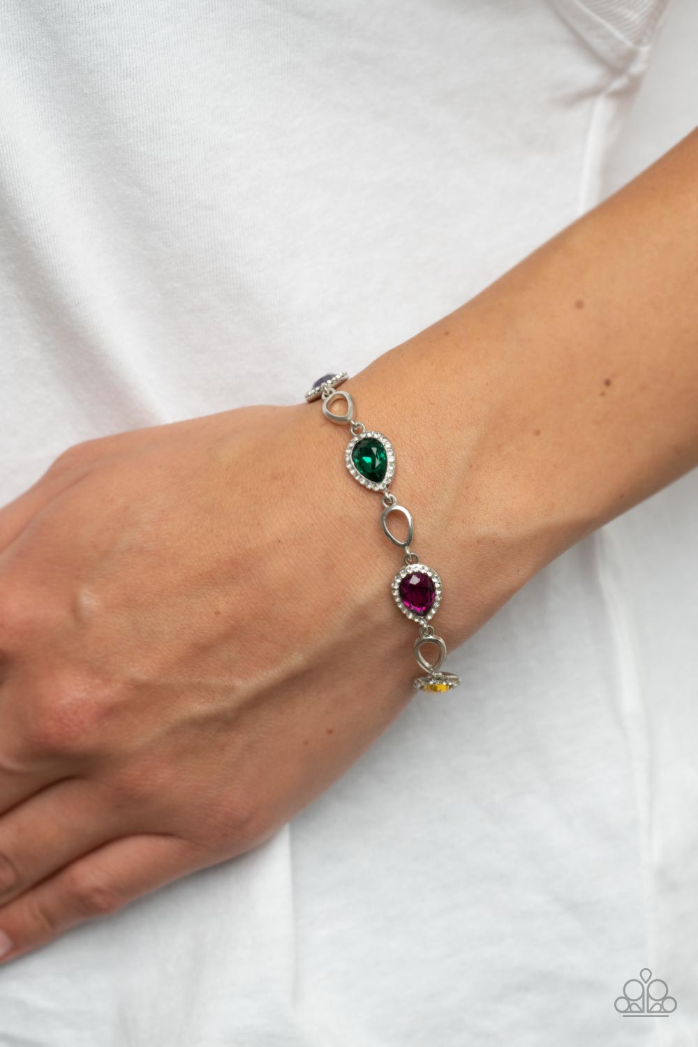 Paparazzi Accessories Timelessly Teary - Multi Bordered in glassy white rhinestones, glittery multicolored teardrop gems link with airy silver teardrop frames around the wrist for a timeless twinkle. Features an adjustable clasp closure. Sold as one indiv