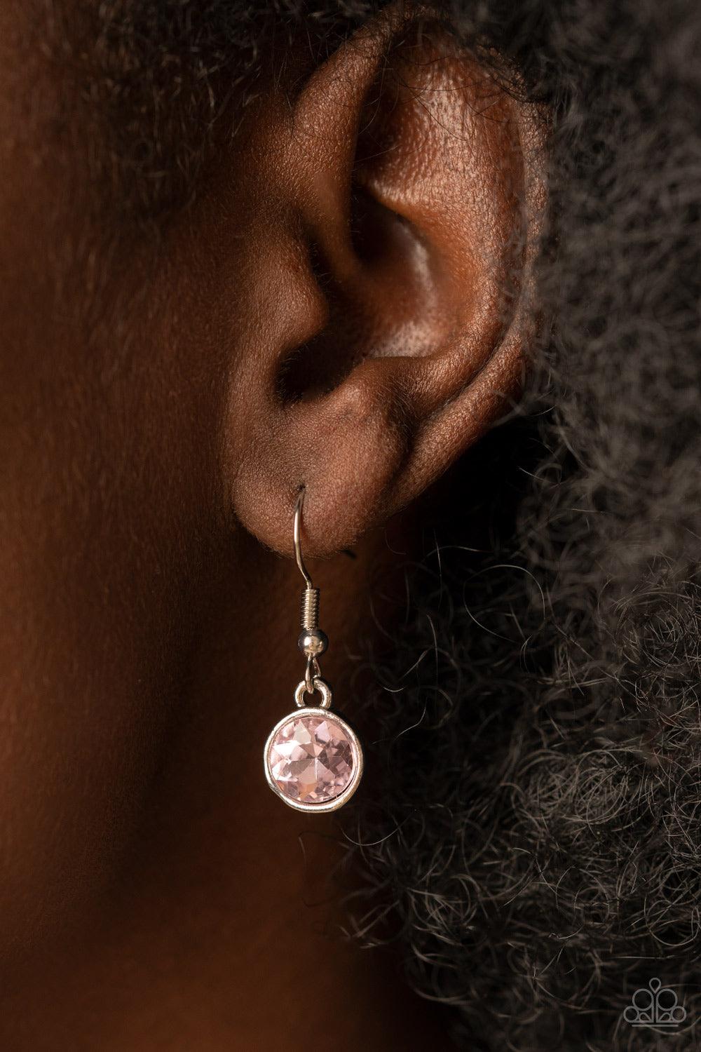 Paparazzi Accessories Pampered Powerhouse - Pink Encased in shiny silver frames, a glitzy collection of pink and iridescent gems gradually increase in size as they link below the collar for a flawless finish. Features an adjustable clasp closure. Sold as