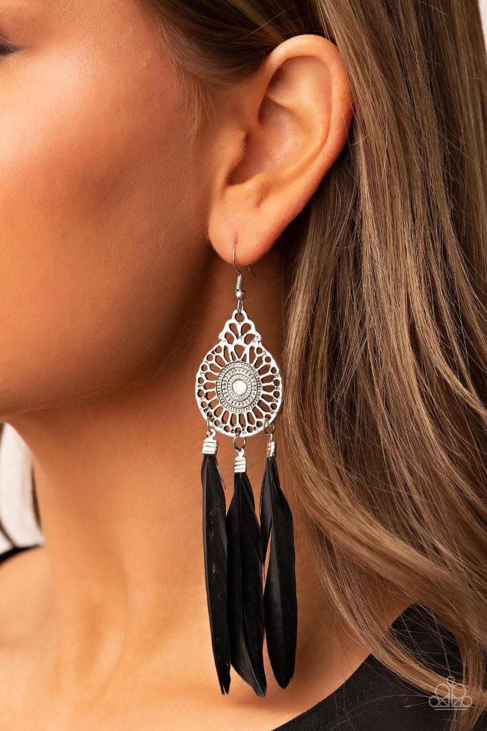 Paparazzi Accessories Pretty in PLUMES - Black Three black feathers swing from the bottom of a dizzying silver frame featuring airy filigree detail, resulting in a flirtatiously colorful fringe. Earring attaches to a standard fishhook fitting. Sold as one