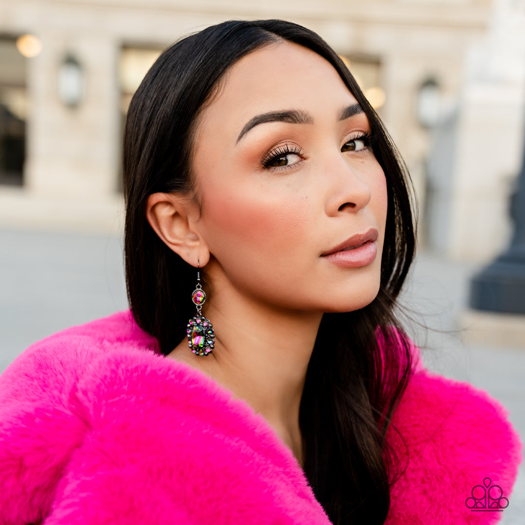 Paparazzi Accessories Capriciously Cosmopolitan - Multi Dainty hematite rhinestones and teardrop oil spill gems fan out from an oversized oil spill emerald cut gem at the bottom of a solitaire oval oil spill gem, resulting in a glamorously glitzy lure. Ea