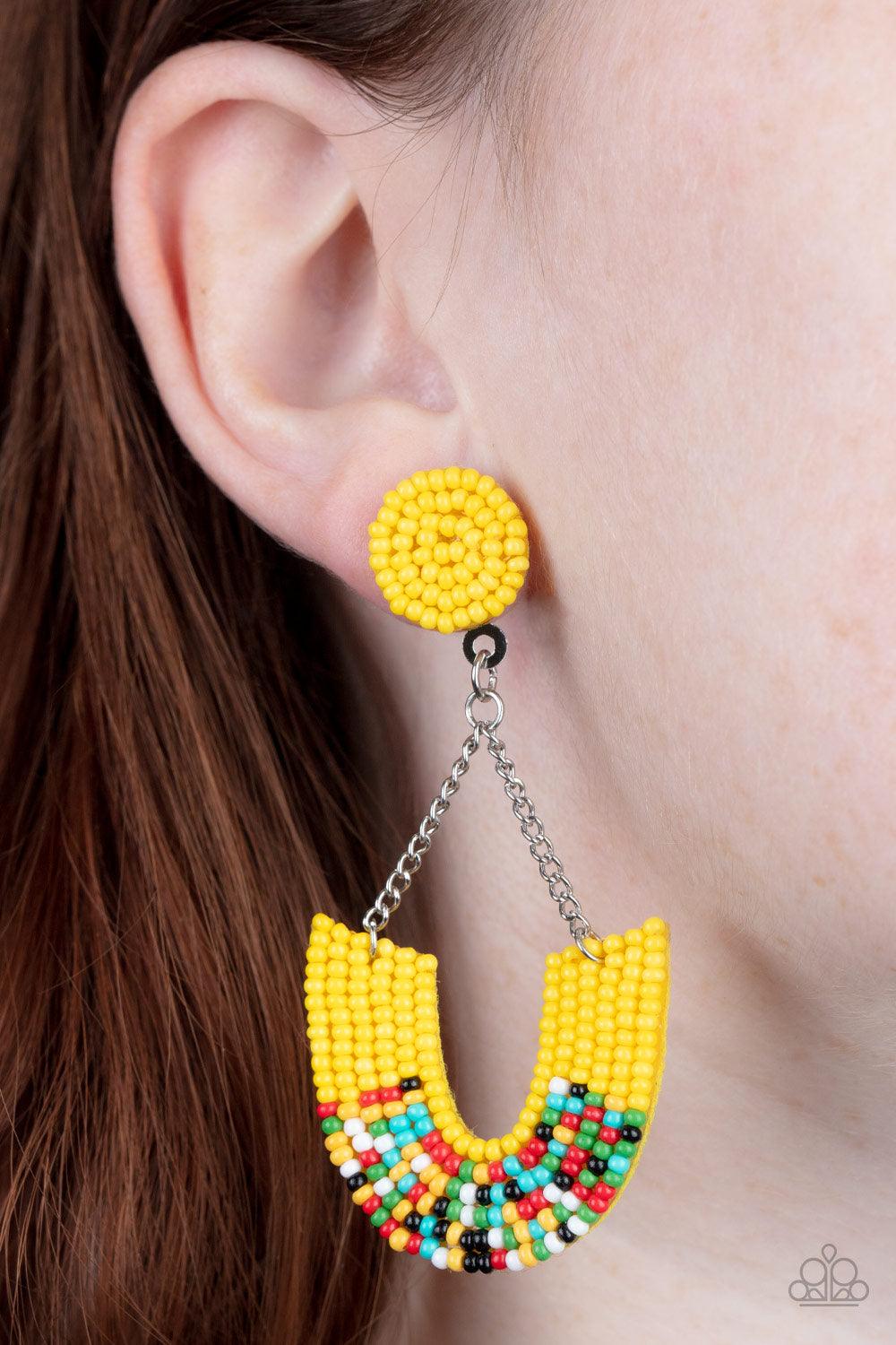 Paparazzi Accessories Make it RAINBOW - Yellow Adorned in sections of Illuminating and multicolored seed beaded accents, a colorful rainbow swings from the bottom of shimmery silver chains that attach to an Illuminating seed beaded disc for a bohemian ins