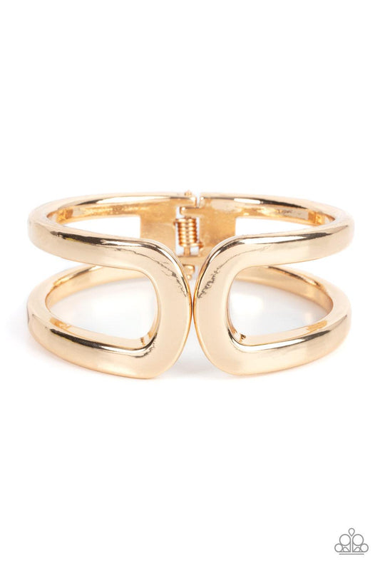 Paparazzi Accessories Industrial Empress - Gold Two oversized gold frames gently curl around the wrist, delicately linking into an impressive cuff-like bangle. Features a hinged closure. Sold as one individual bracelet. Bracelets