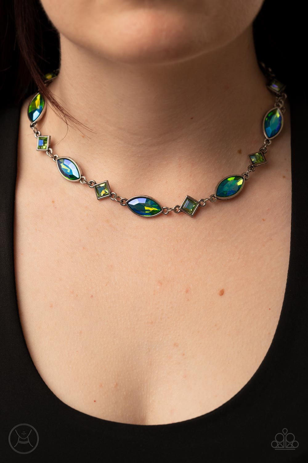 Paparazzi Accessories Prismatic Reinforcements - Green Encased in sleek silver fittings, an iridescent collection of green marquise and square cut rhinestones delicately links below the collar for a prismatic pop of color. Features an adjustable clasp clo