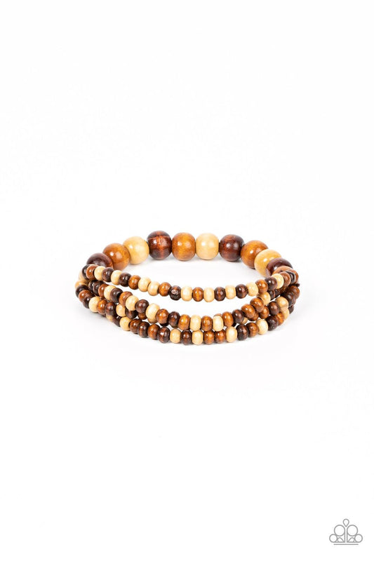 Paparazzi Accessories Oceania Oasis - Brown Varying in natural wooden finishes, stretchy strands of dainty wooden beads attach to a single row of oversized wooden beads around the wrist for an earthy spin on the homespun trend. Sold as one individual brac