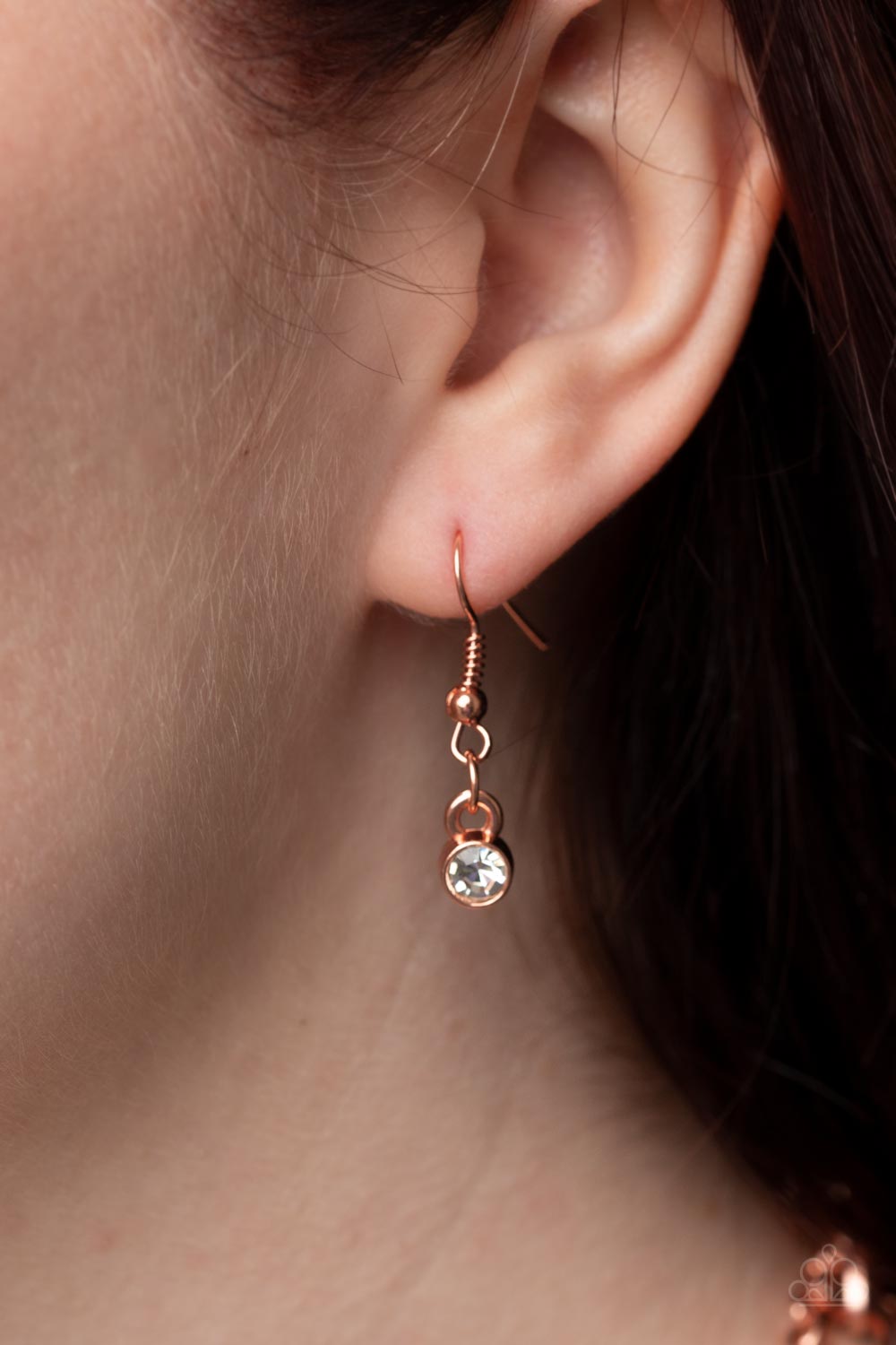 Paparazzi Accessories Highlight of My Life - Copper Sporadically dotted in glittery white rhinestones, an oversized hammered shiny copper disc is suspended from the lowermost of two mismatched shiny copper chains below the collar for a retro look. Feature