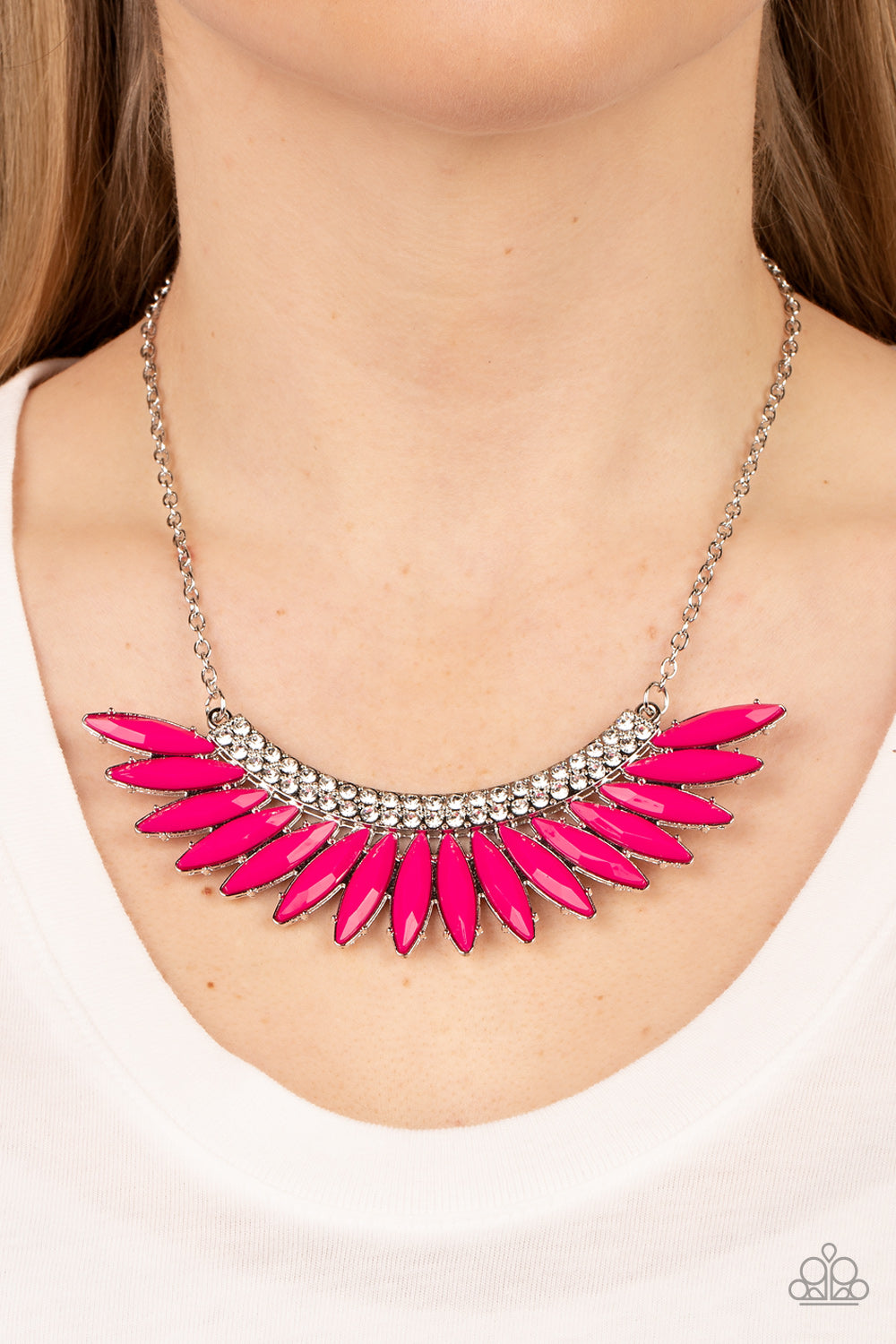 Paparazzi Accessories Flauntable Flamboyance - Pink A faceted row of marquise cut Fuchsia Fedora beads fans out from the bottom of a curved silver frame extravagantly embellished in glassy white rhinestones, coalescing in a flauntable centerpiece below th