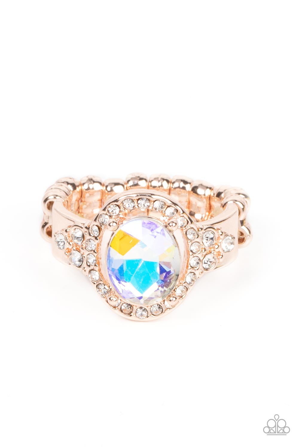 Paparazzi Accessories Dazzling I Do’s - Rose Gold Reminiscent of an engagement ring, an iridescent oval gem is showcased atop a white rhinestone encrusted rose gold setting for an elegantly stellar finish. Features a dainty stretchy band for a flexible fi