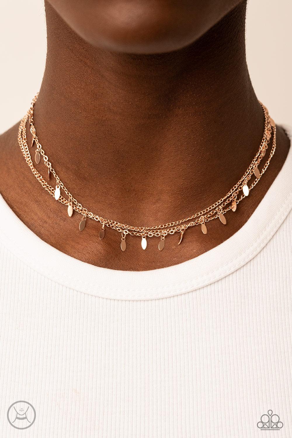 Paparazzi Accessories Monochromatic Magic - Rose Gold Infused with two dainty rows of rose gold chains, a row of rose gold oval discs glisten around the neck for a playful look. Features an adjustable clasp closure. Sold as one individual choker necklace.