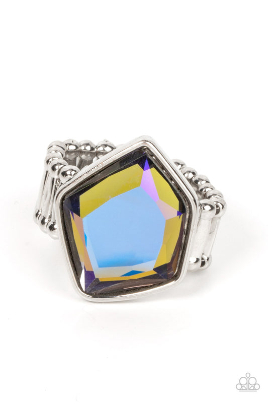 Paparazzi Accessories Abstract Escapade - Multi Featuring a purple UV finish, a faceted geometric multicolored gem sits asymmetrically atop the finger for a stellar finish. Features a stretchy band for a flexible fit. Sold as one individual ring. Jewelry