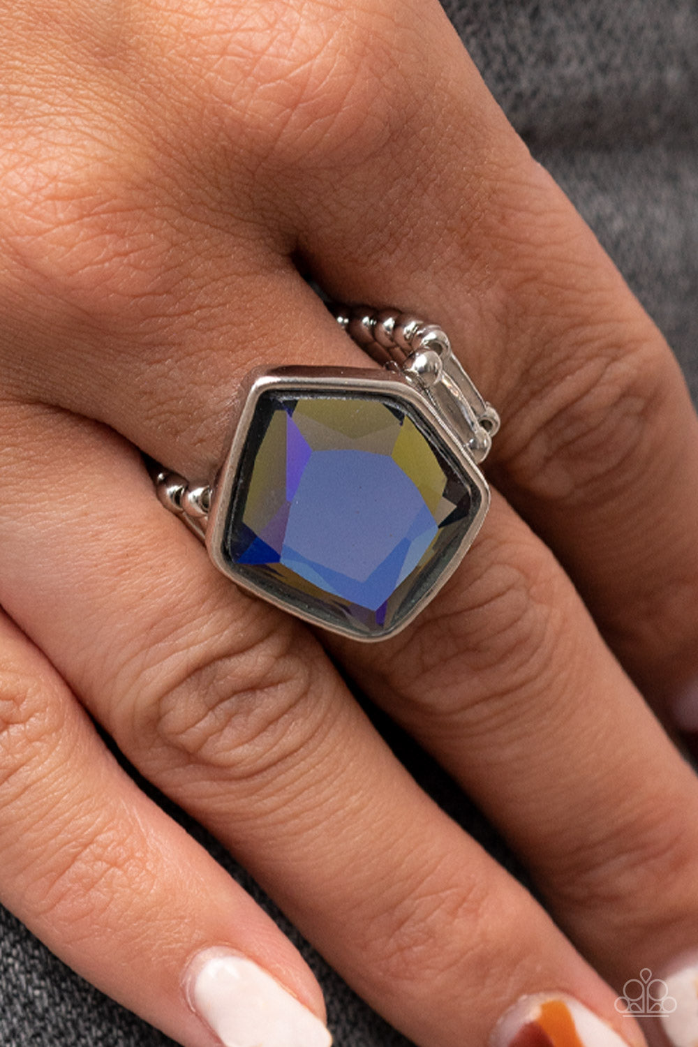 Paparazzi Accessories Abstract Escapade - Multi Featuring a purple UV finish, a faceted geometric multicolored gem sits asymmetrically atop the finger for a stellar finish. Features a stretchy band for a flexible fit. Sold as one individual ring. Jewelry