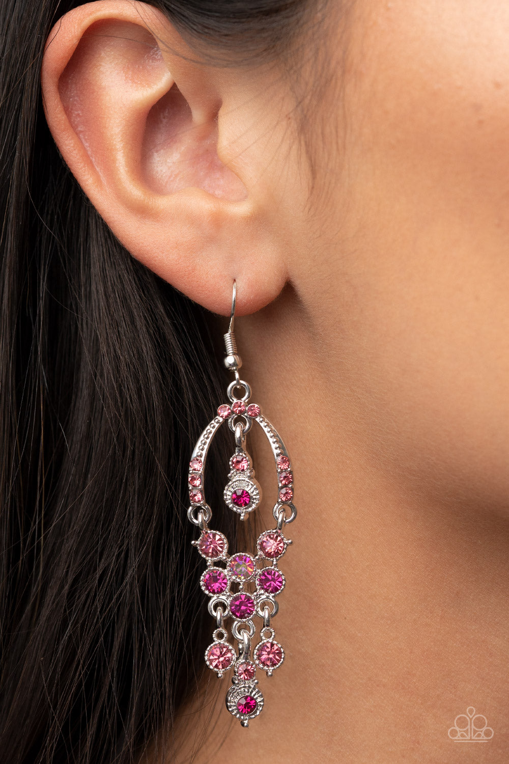 Paparazzi Accessories Sophisticated Starlet - Pink A pink rhinestone encrusted silver horseshoe frame delicately attaches to a glitzy tassel of pink, Fuchsia Fedora, and iridescent rhinestones for a timeless twinkle. A matching pink and Fuchsia Fedora rhi