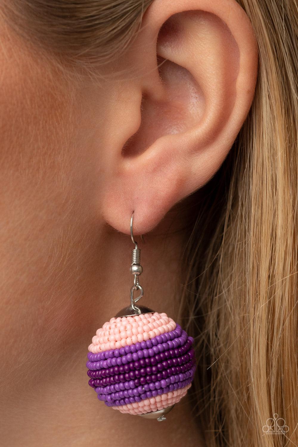 Paparazzi Accessories Zest Fest - Purple Strands of Pale Rosette, purple, and plum seed beads decoratively spin around a spherical frame, resulting in a colorful 3-dimensional display. Earring attaches to a standard fishhook fitting. Sold as one pair of e