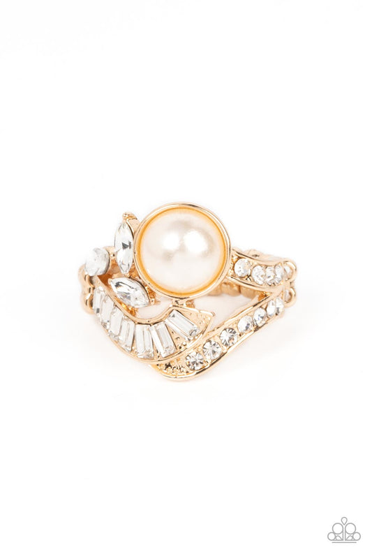 Paparazzi Accessories SELFIE-Made Millionaire - Gold Gold ribbons adorned in round and emerald cut rhinestones delicately nestle around an oversized white pearl. Enhanced with a trio of white marquise cut rhinestones, the lavishly layered centerpiece spar