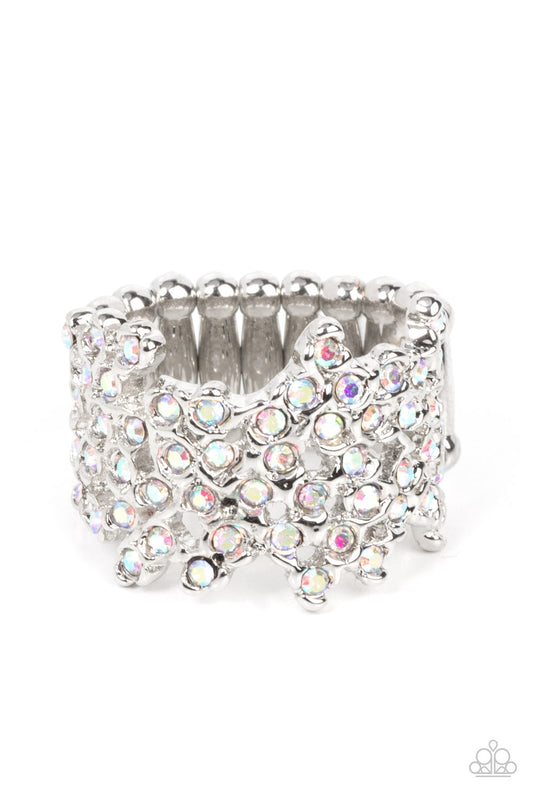 Paparazzi Accessories Sizzling Shimmer - Multi Enhanced with shiny silver fittings, glittery iridescent rhinestones scatter across the finger for a subtle shimmer. Features a stretchy band for a flexible fit. Sold as one individual ring. Jewelry