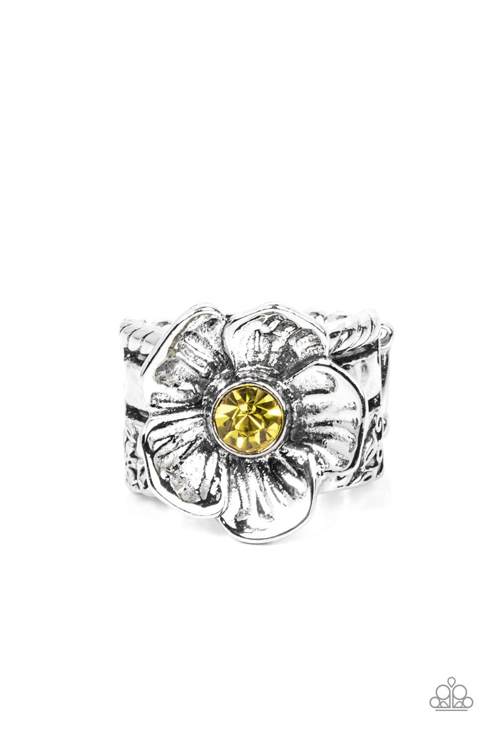 Paparazzi Accessories Prismatically Petunia - Yellow Textured silver petals gently gather around a sparkling yellow rhinestone center, blooming into a dazzling floral centerpiece atop the finger. Features a stretchy band for a flexible fit. Sold as one in