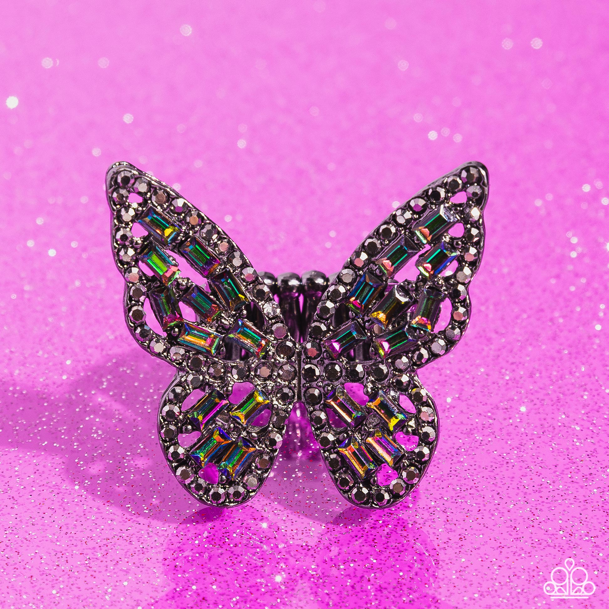 Paparazzi Accessories Flauntable Flutter - Multi Dainty oil spill emerald-cut rhinestones are sprinkled across the gunmetal wings of a butterfly that is encrusted in dauntless hematite rhinestones for a dramatically dazzling finish. Features a stretchy ba