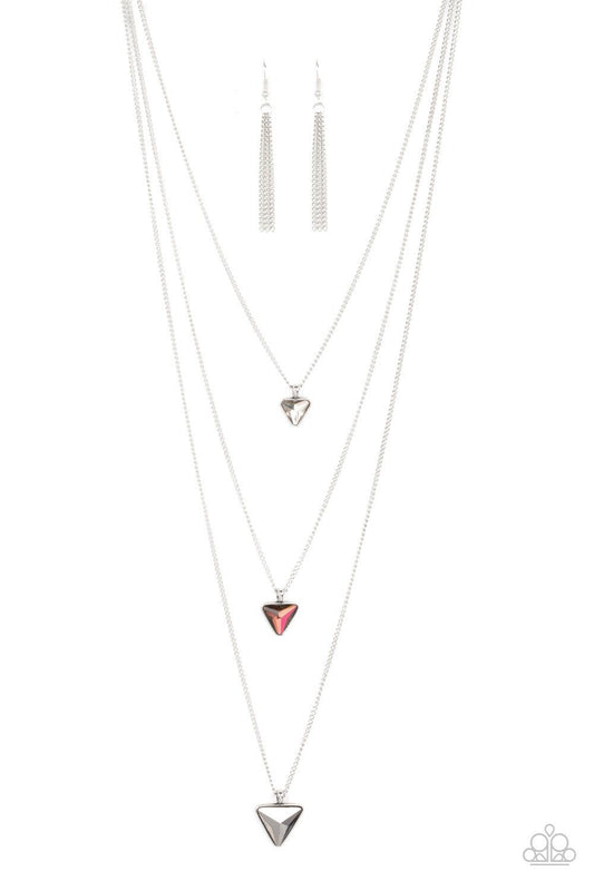 Paparazzi Accessories Follow the LUSTER - Multi Glassy white, oil spill, and hematite triangular gems gradually increase in size as they swing from the bottoms of extended silver chains, layering into an edgy shimmer across the chest. Features an adjustab