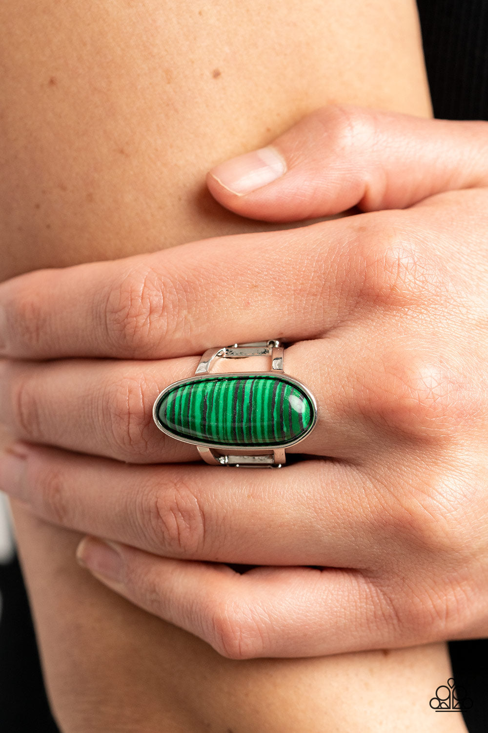Paparazzi Accessories Eco Expression - Green Painted in a faux stone finish, an oblong green bead is pressed into a sleek silver fitting atop layered silver bands for an artisanal finish. Features a stretchy band for a flexible fit. Sold as one individual