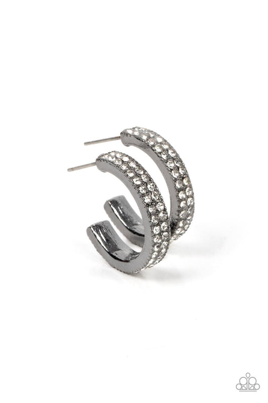 Paparazzi Accessories Small Town Twinkle - Black Two rows of glassy white rhinestones encrust the front of a dainty gunmetal hoop, resulting in a timeless twinkle. Earring attaches to a standard post fitting. Hoop measures approximately 3/4" in diameter.