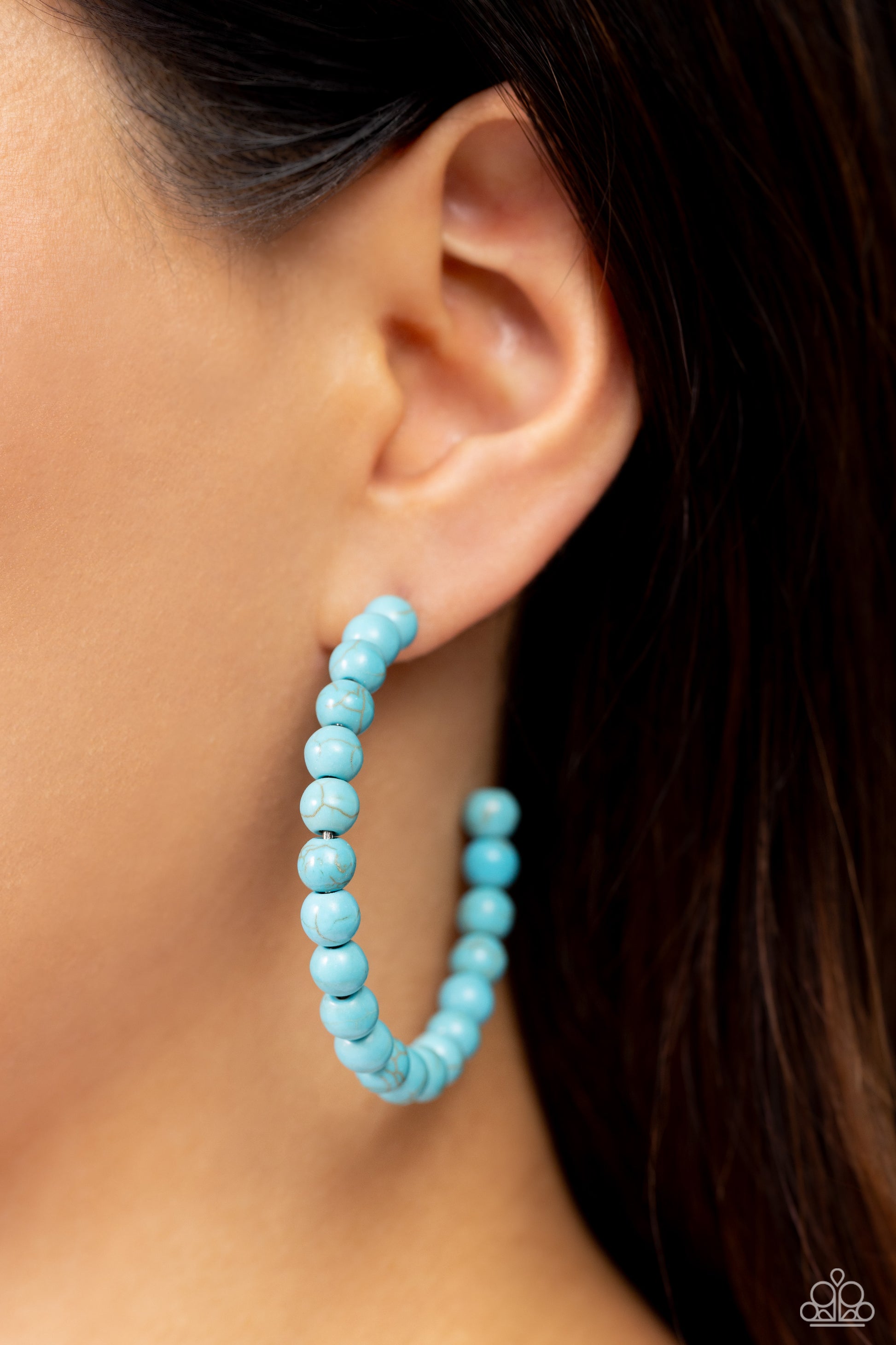 Paparazzi Accessories Rural Retrograde - Blue Refreshing turquoise stone beads are threaded along a dainty wire hoop, resulting in an earthy flair. Earring attaches to a standard post fitting. Hoop measures approximately 2" in diameter. Sold as one pair o