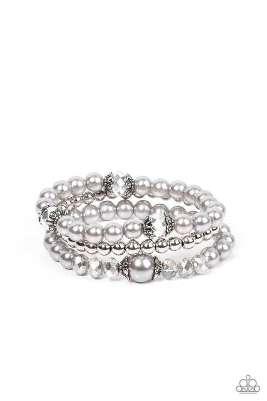Paparazzi Accessories Positively Polished - Silver Stretchy silver pearl and silver beaded bracelets are adorned with ornate silver accents and glassy hematite flecked crystal-like beads, creating polished layers around the wrist. Sold as one set of three