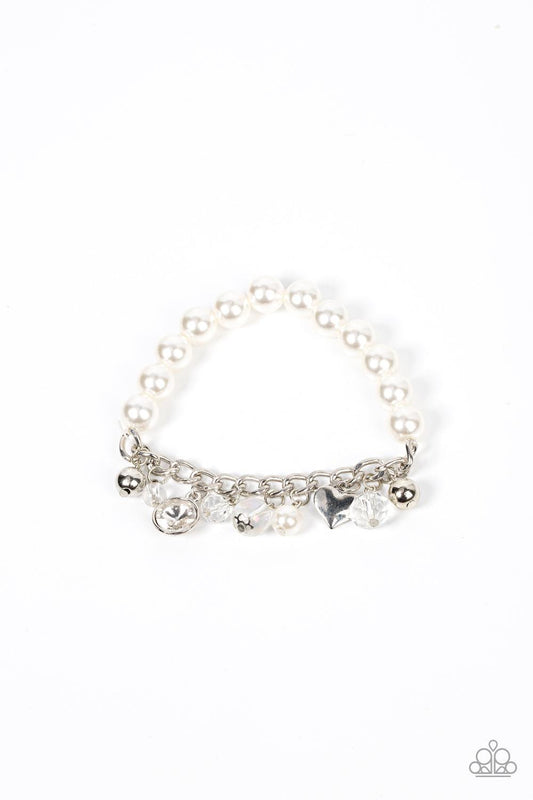 Paparazzi Accessories Adorningly Admirable - White Mismatched silver beads, white pearls, crystal-like accents, gems and heart charms dance from a section of silver chain that attaches to a stretchy band of white pearls around the wrist for a flirtatious