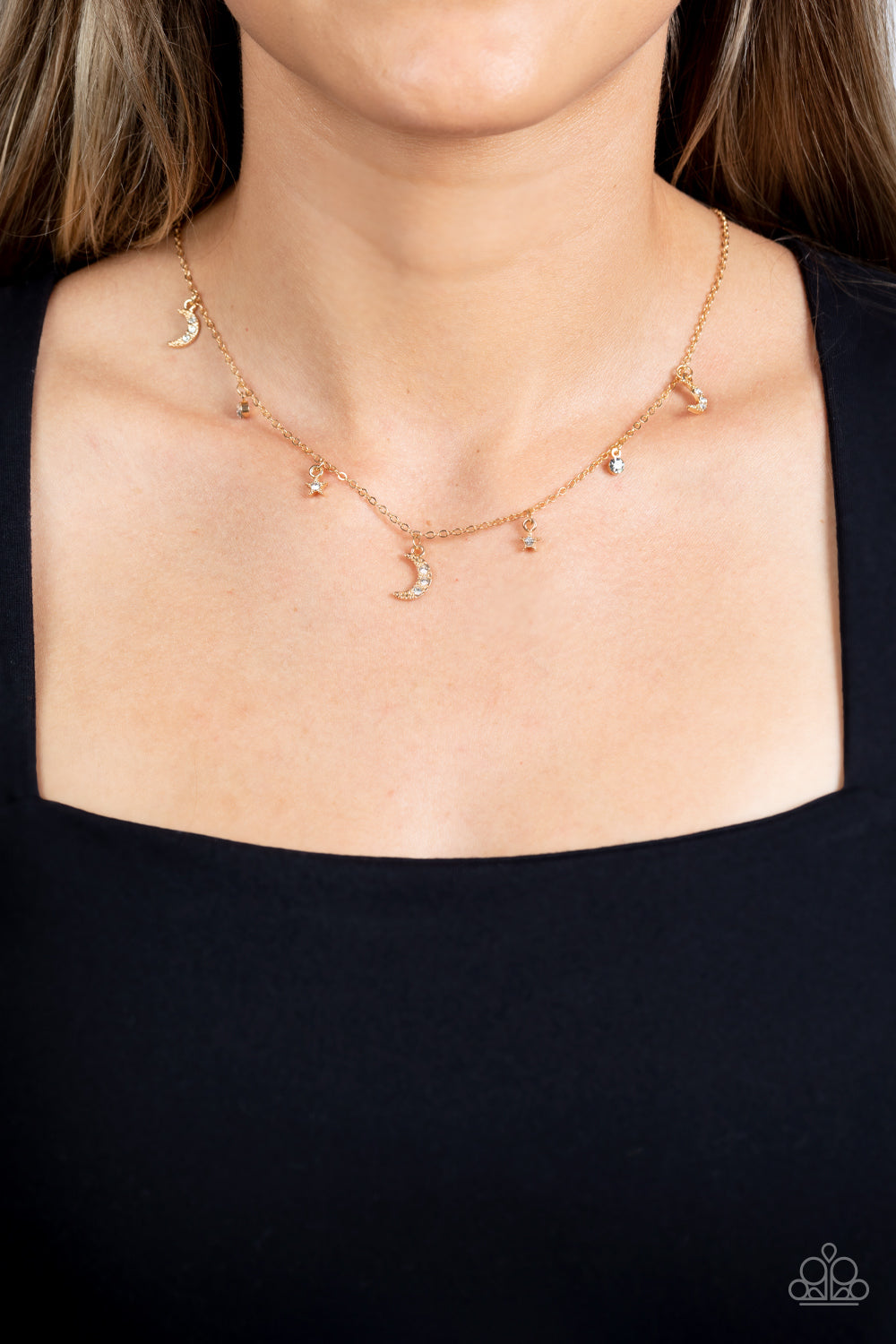 Paparazzi Accessories Lunar Lagoon - Gold Dotted with dainty white rhinestones, a cosmic collection of gold moon and star charms swings from a dainty gold chain below the collar. Solitaire white rhinestones sparkle in between the charms, adding additional