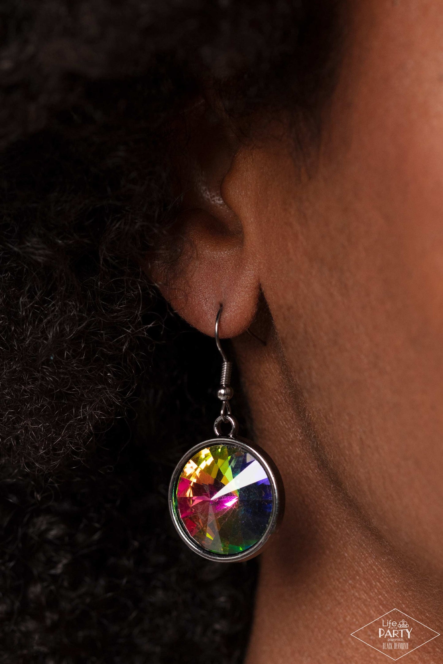 Paparazzi Accessories Hypnotized - Multi Three dramatically oversized oil spill rhinestones are nestled into three textured gunmetal fittings that are connected by oval gunmetal rings, creating a brilliant statement piece. Features an adjustable clasp clo