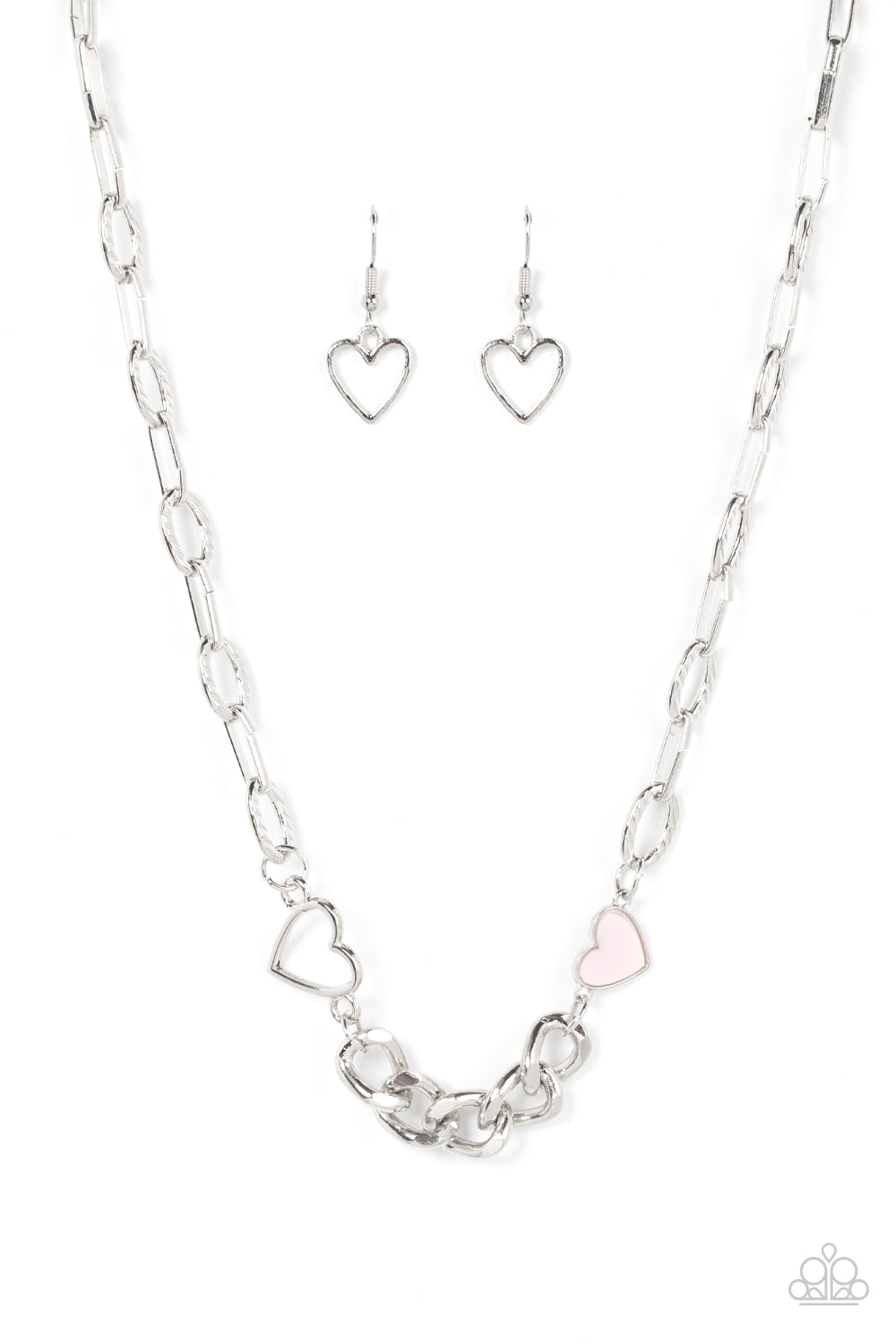Paparazzi Accessories Little Charmer - Pink A pair of shiny silver and Pale Rosette hearts asymmetrically adorn sections of mismatched silver chain, resulting in a flirtatious pop of color below the collar. Features an adjustable clasp closure. Sold as on