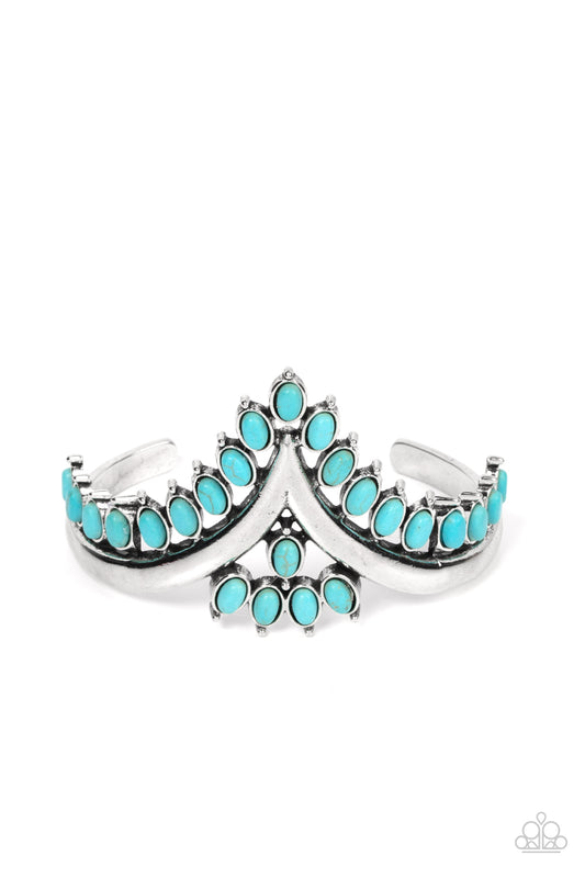 Paparazzi Accessories Teton Tiara - Blue Turquoise oval stones, encased in studded silver frames, line the edge of a daring V-shaped silver cuff. A gathering of turquoise stones adorns the center of the bracelet, adding a finishing touch to the rustically