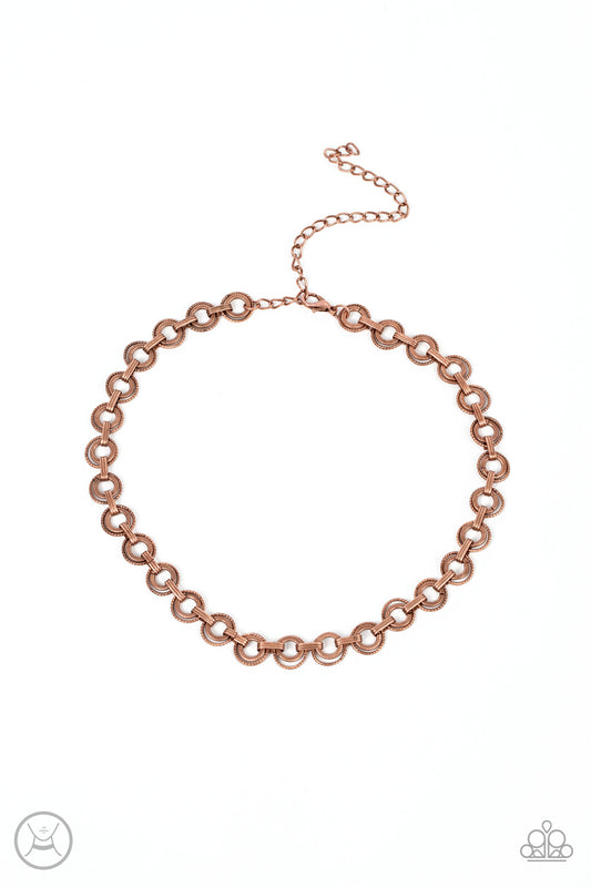 Paparazzi Accessories Grit and Grind - Copper Dainty pairs of textured copper hoops and rings link with pinched copper fittings around the neck, resulting in a gritty vibe. Features an adjustable clasp closure. Sold as one individual choker necklace. Incl