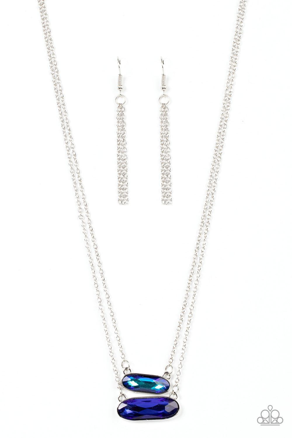 Paparazzi Accessories Double Bubble Burst - Blue Featuring faceted oblong cuts, a UV blue gem is delicately suspended above a slightly larger glittery blue gem below the collar for a stellar double-stacked display. Features an adjustable clasp closure. So