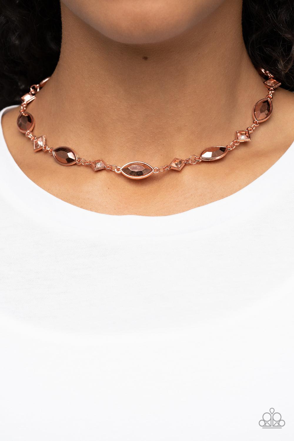 Paparazzi Accessories Prismatic Reinforcements - Copper Encased in shiny copper fittings, a glitzy collection of coppery metallic marquise cut gems and square cut peach rhinestones delicately links below the collar for a prismatic pop of color. Features a