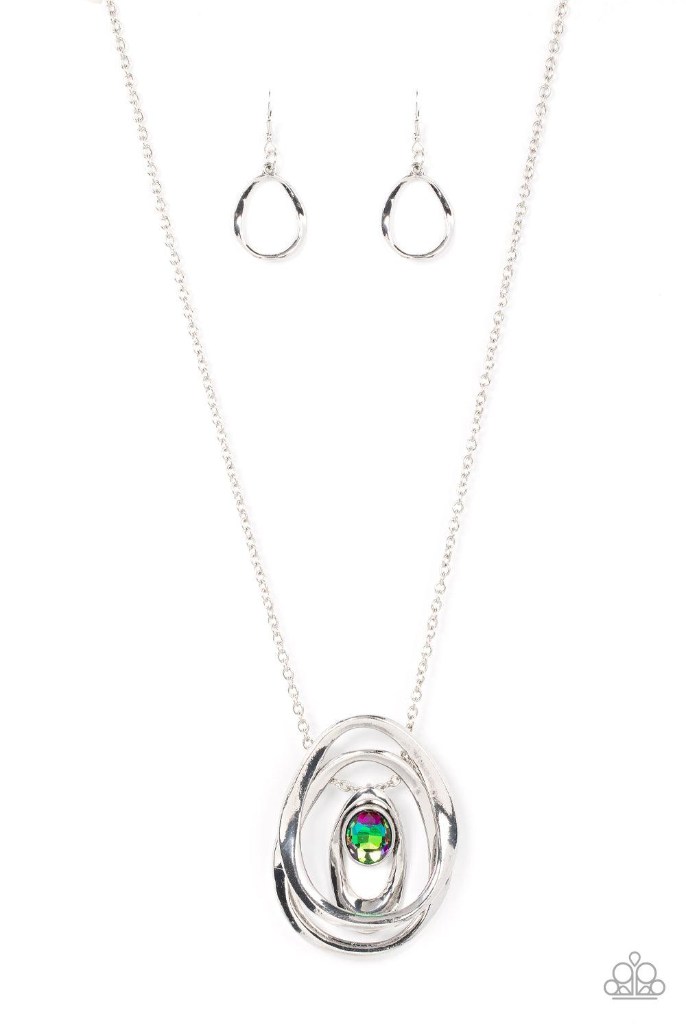 Paparazzi Accessories Luminous Labyrinth - Multi An oversized glittery gem seemingly floats inside an asymmetrical silver oval that glides between two oversized silver ovals at the bottom of an extended silver chain, creating an edgy pendant. Features an