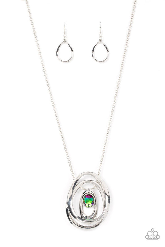 Paparazzi Accessories Luminous Labyrinth - Multi An oversized glittery gem seemingly floats inside an asymmetrical silver oval that glides between two oversized silver ovals at the bottom of an extended silver chain, creating an edgy pendant. Features an