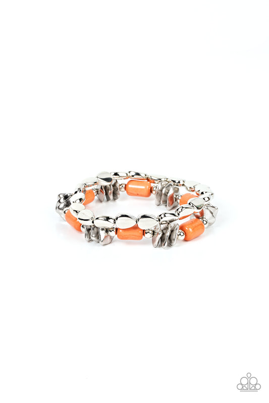 Paparazzi Accessories Canyon Cavern - Orange A mismatched collection of faceted silver accents, dainty silver beads, silver faux stones, and cylindrical burnt orange stones are threaded along stretchy bands around the wrist, creating an earthy pair of bra
