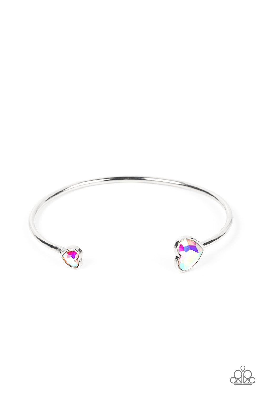 Paparazzi Accessories Unrequited Love - Multi Enhanced with iridescent rhinestones, two silver hearts adorn the ends of a silver band that curls around the wrist for a flirtatious open-faced style cuff. Sold as one individual bracelet. Bracelets